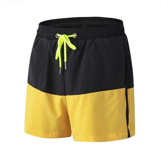 Men's loose elastic quick drying sports shorts black and yellow patchwork